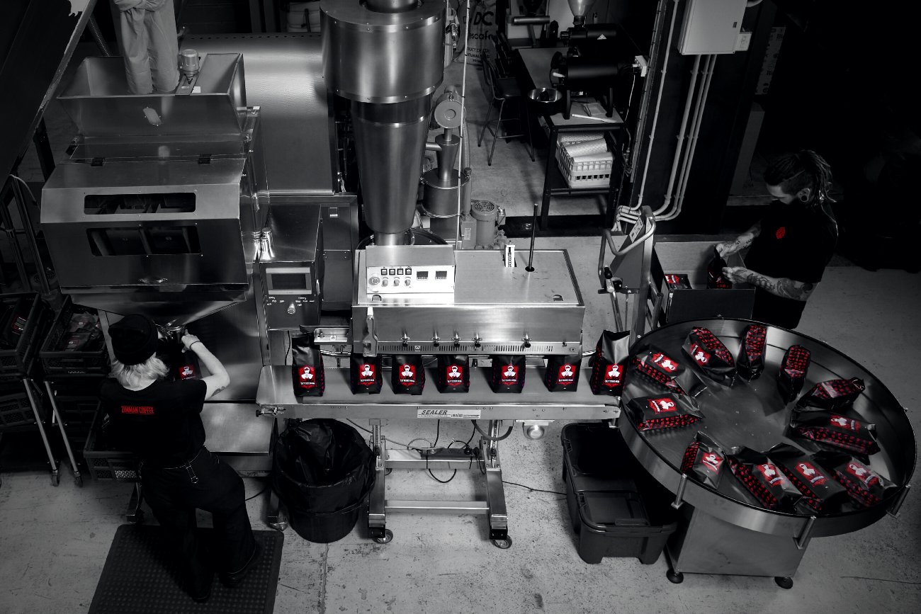The Zimmah packing line — bags coming off the sealer on Murray Street